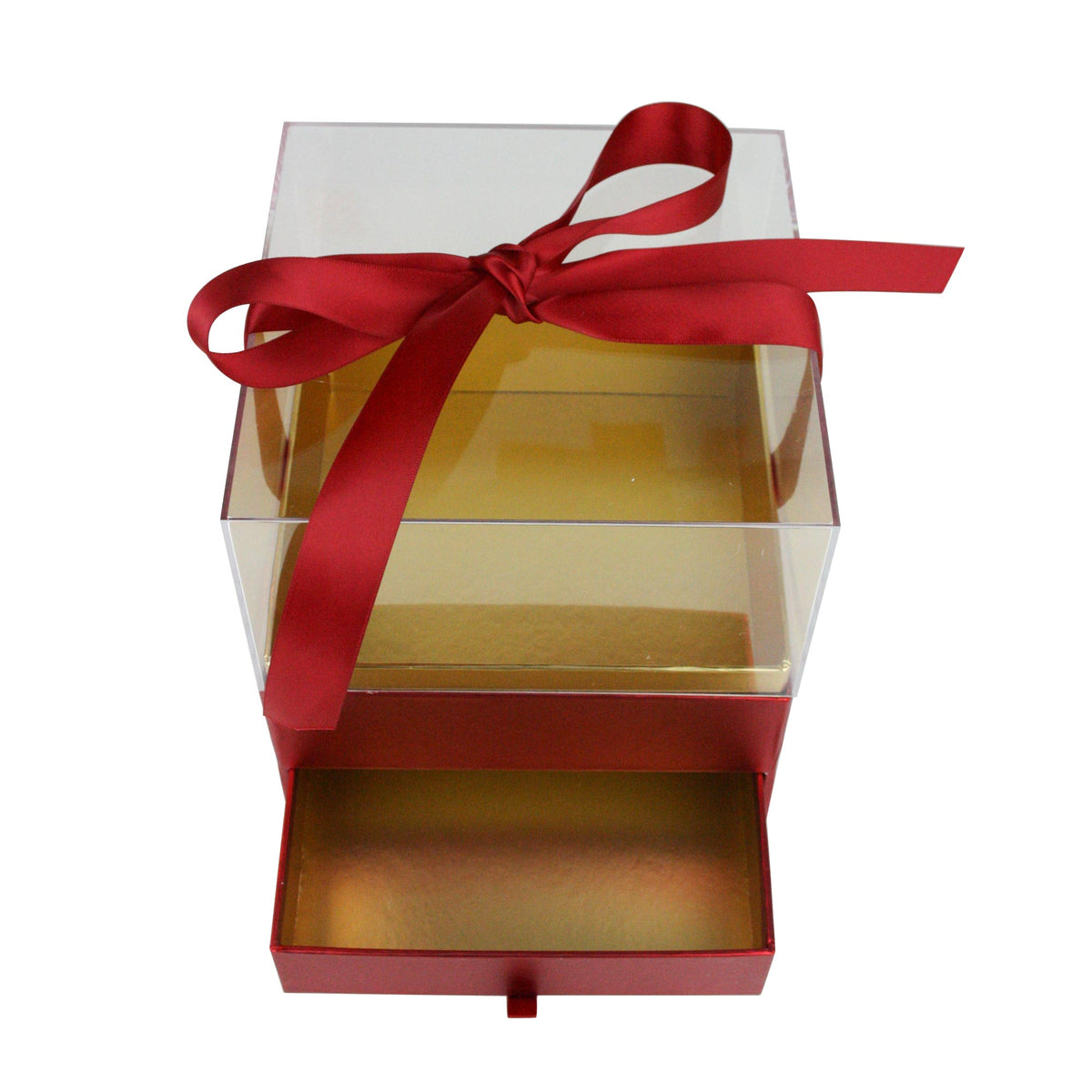 Close-up of red and gold acrylic gift box with ribbon